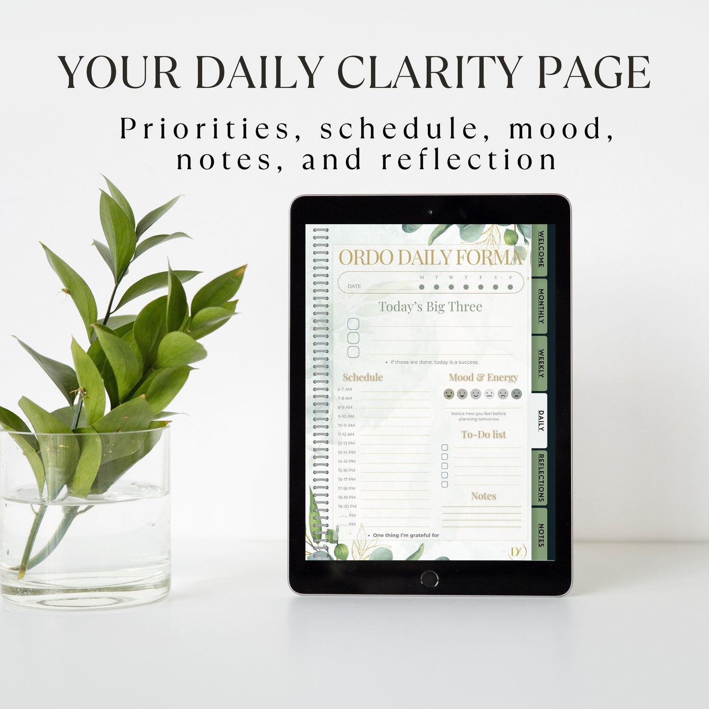 Digital tablet displaying a daily clarity page with a plant on a white surface