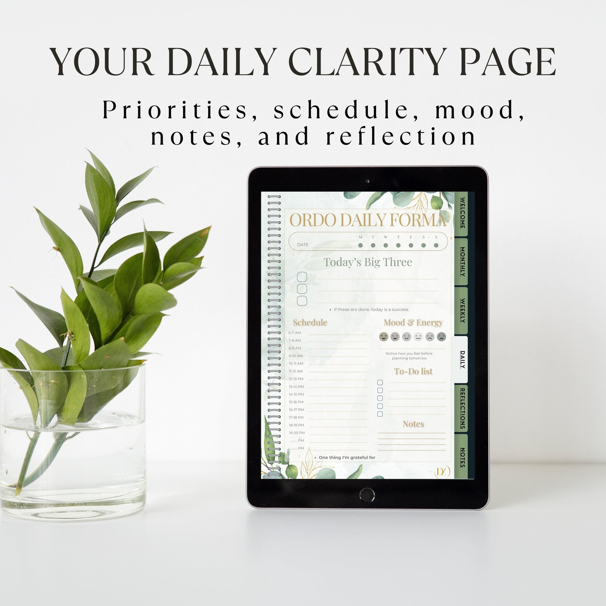 Digital tablet displaying a daily clarity page with a plant on a white surface