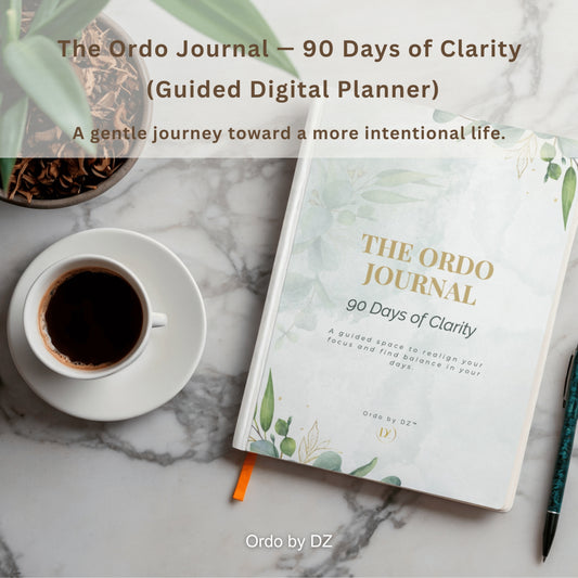The Ordo Journal on a marble surface with a cup of coffee and pen, featuring text about 90 days of clarity. front cover