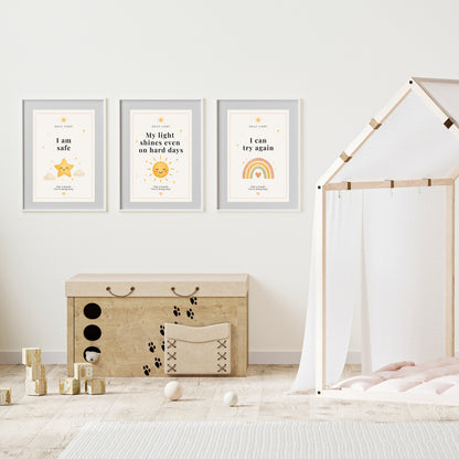 Children's room with framed motivational posters on the wall, a wooden storage box, and toys.